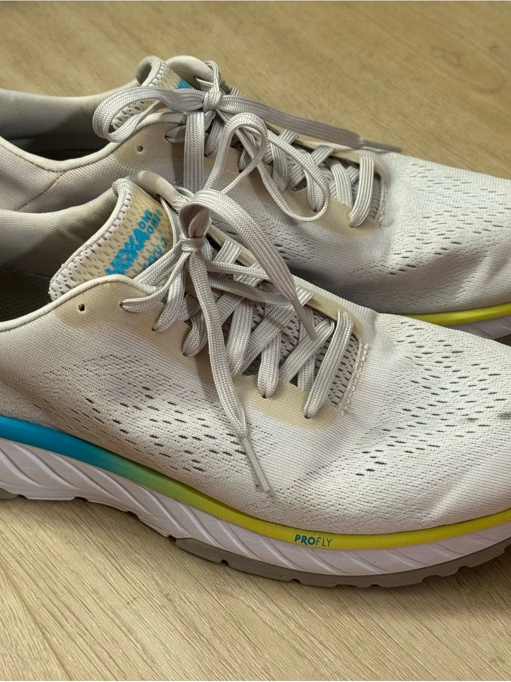 Hoka Women's Grey Running Shoes with Blue and Yellow Accents